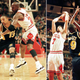 Michael Jordan rides Mark Jackson; Toni Kukoc secures a rebound. Photos via Getty.